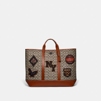 Toby Turnlock Tote In Signature Textile Jacquard With Varsity Patches product