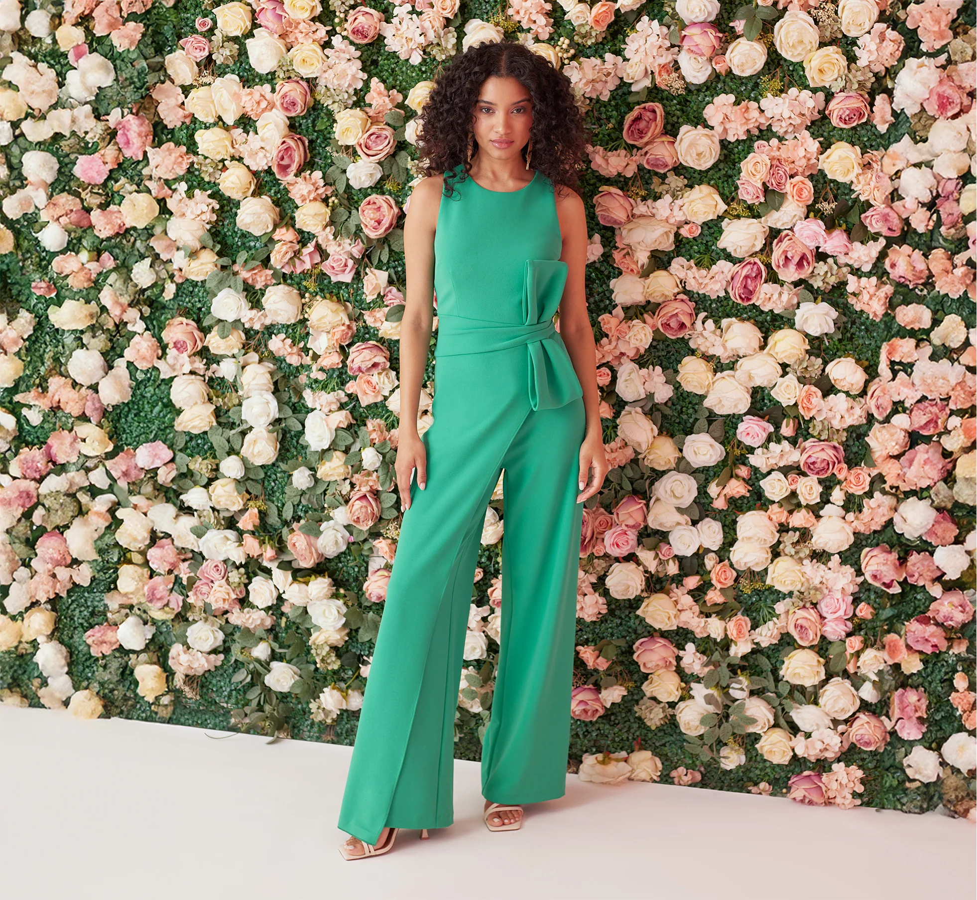 WIDE LEG CREPE JUMPSUIT WITH BOW ACCENT IN BOTANIC GREEN