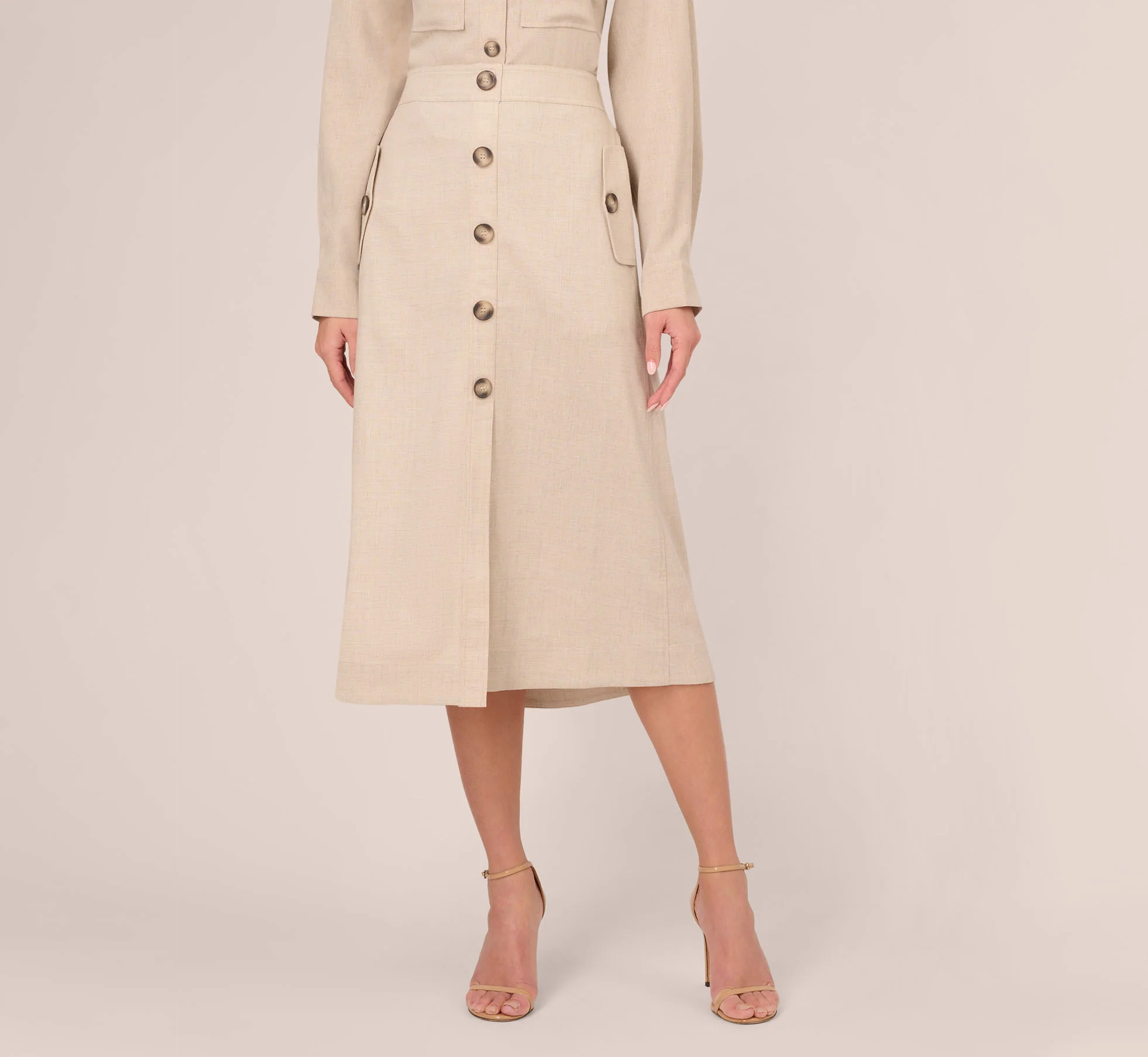 A LINE BUTTON FRONT SKIRT WITH FLAP POCKETS IN FLAX